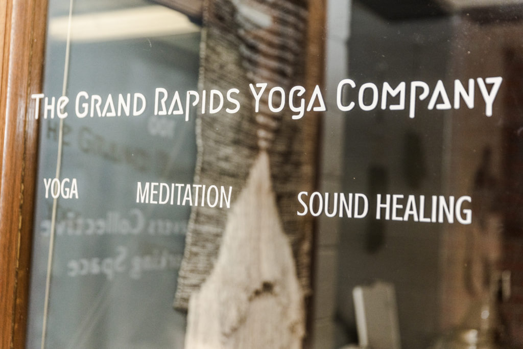 The door at the Grand Rapids yoga Company with a view inside the building. 